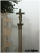 Crucero con doble talla y torre románica al fondo, Iglesia de San Pedro de Tineo - Asturias